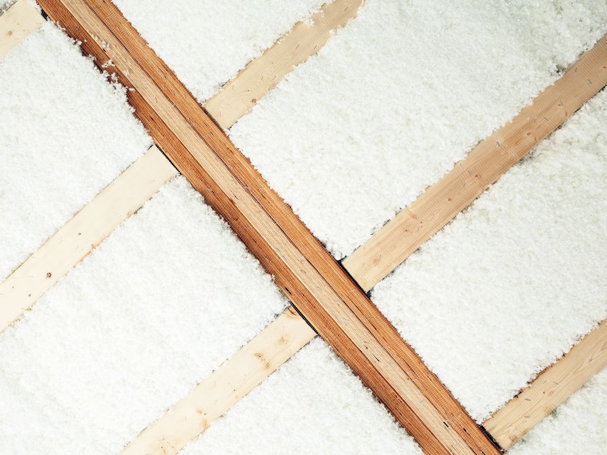 Close-up view of a roof showcasing insulation material, highlighting its texture and installation details.